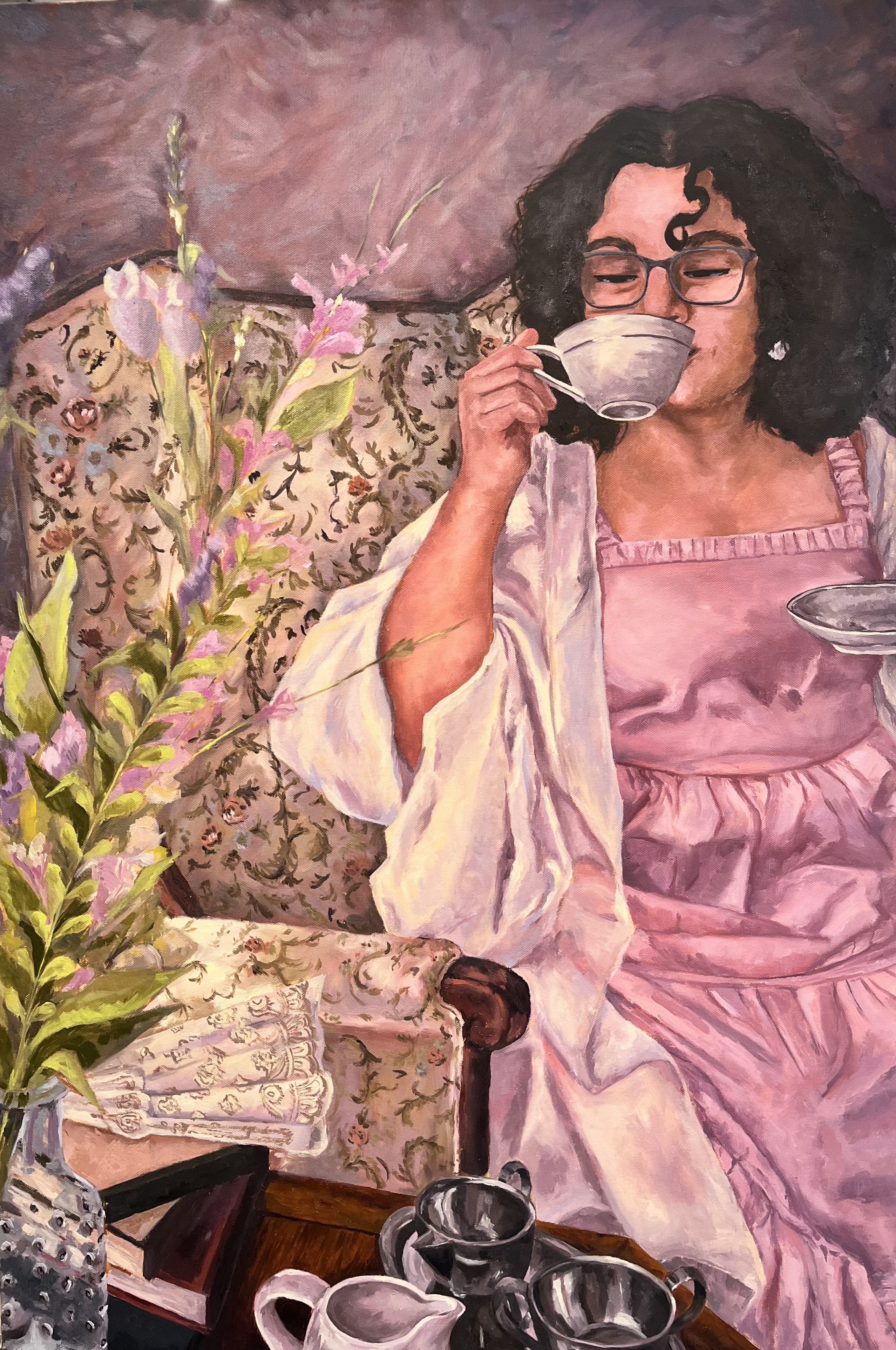 a girl holding a cup